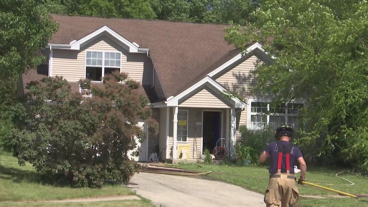 Firefighters battle Rockford house fire - YouTube