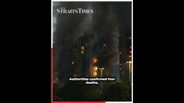 Four dead, residents trapped as blaze rips through Hong Kong residential towers