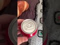 Girl shows empty coke zero can