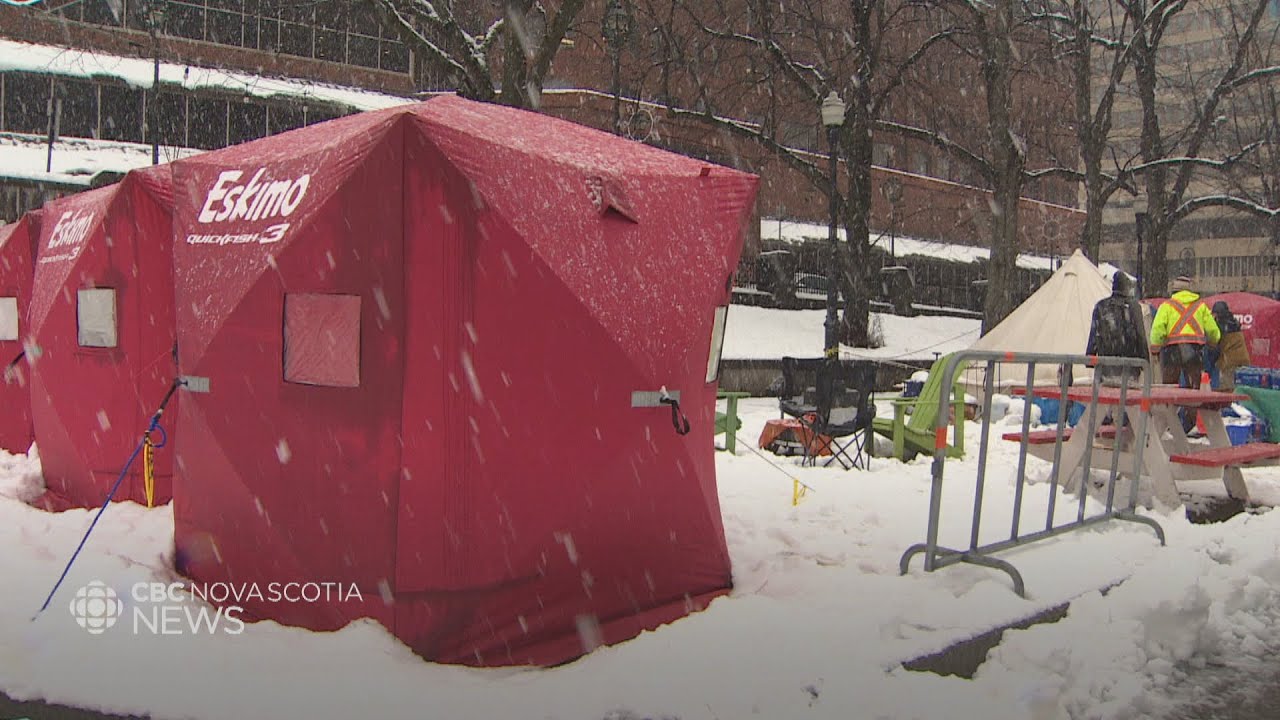 People living in tents given ice-fishing huts to protect against winter  weather 