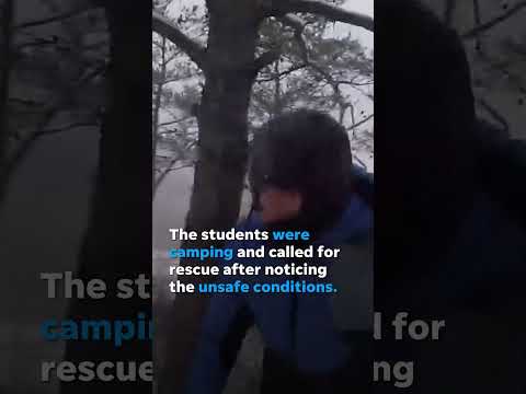 Watch: Snowy helicopter rescue of stranded college students #Shorts