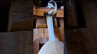 Shaving and smoothing a handmade wooden spoon handle using a traditional Japanese hand plane