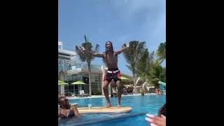 Boy Slips into the Pool While Dancing