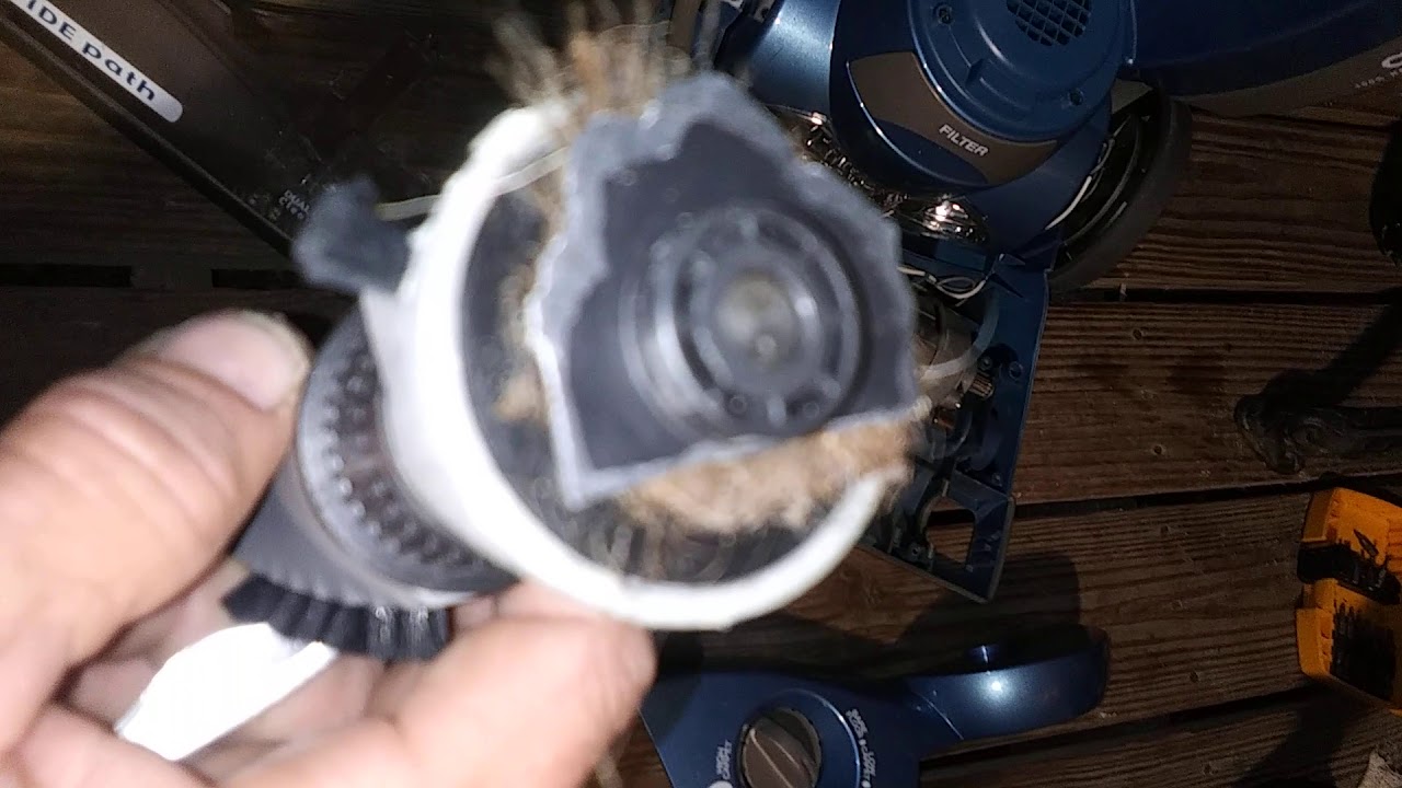 cleaning brush roller bearings of hair 
