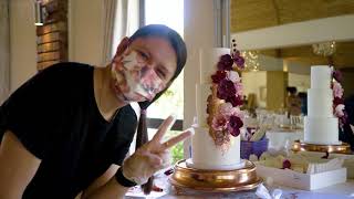 Stacking a 3 tier cake with flowers and rose gold details - time lapse screenshot 3