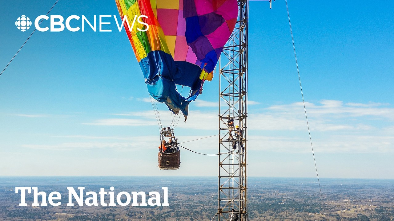 #TheMoment a hot air balloon got stuck in a cellphone tower