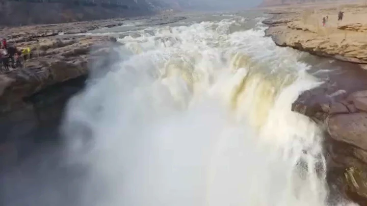 Former frozen Hukou waterfall thaws out in north China