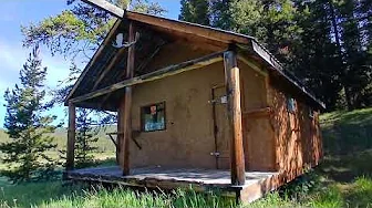 Trapper cabin in the mountains by a creek very quiet spot rocky mountain house alberta 