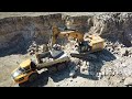 Cat 374F L loading Volvo A40G - drone video