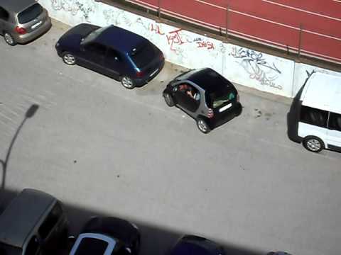 spanish woman is parking her SMART car  :-D