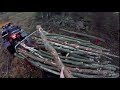 PULLING A HEAVY LOAD OF FIREWOOD IN ROUGH TERRAIN WITH THE ATV