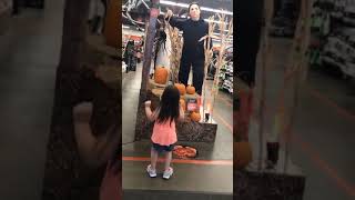 Little Girl Dances to Halloween Store Display