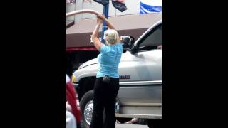 Woman swinging a HUGE dildo