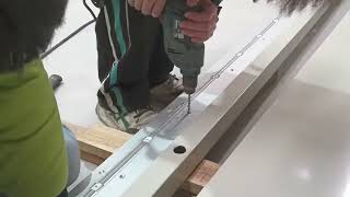 Continuous geared hinge installation of super large door