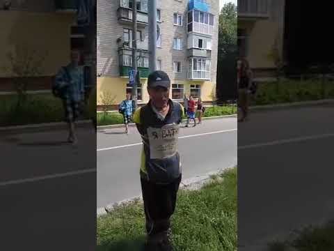 Ukrainian nationalists tie old man to a pole, police shakes hands with them and laugh