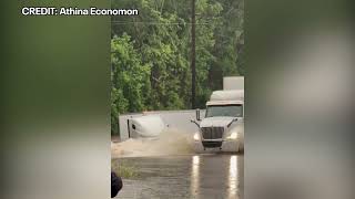 Flooded roadway in Houston swallows up 18-wheeler