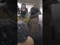 Exchange between two men with flags and a group of others amid the anti-ICE unrest in Minneapolis.