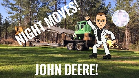 John Deere loader loading Peterbilt log trucks in the dark!
