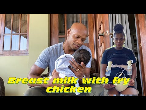 WHAT IS HE DOING WITH THE BABY?