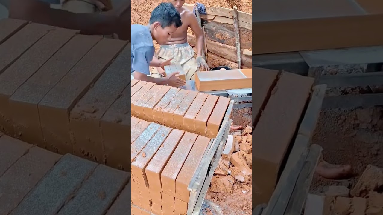 A worker uses wire cutter to slice earthen bricks