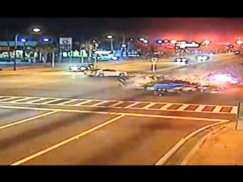 Caught on video: Cop runs red light during chase & is ticketed after crash