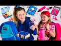 Pink and blue school backpack challenge with sisters play family