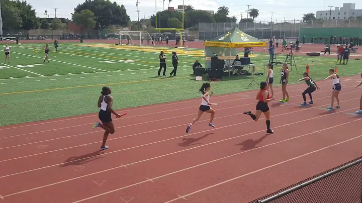 Ziann Jefferson runs anchor leg of 4x400 relay.  L...