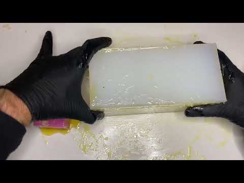 Resin casting a car body. Removing master from mould and pouring the resin.