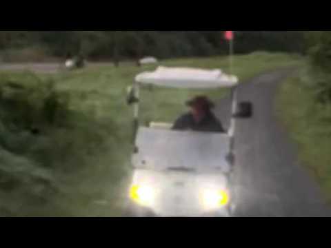 Video shows man in golf cart chasing off bicyclist