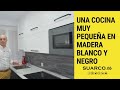 Cocina pequeña en madera blanca y negra con silestone blanco zeus