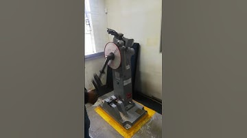 MECHANICAL TESTING LABORATORY: LIFTING THE HEAVY IMPACT TESTING HUMMER BEFORE BREAKING CHARPY SAMPLE