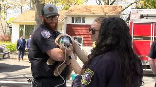 Galloway Twp EMTs give oxygen to a dog, rescued from a house fire by firefighters.