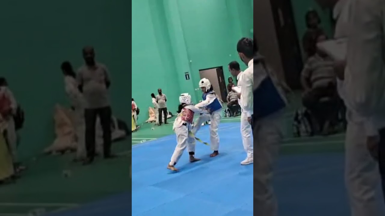 me in the red chest guard TAEKWONDO match