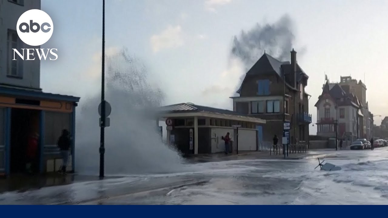 Giant waves crash over seawall, flooding street in western France - YouTube