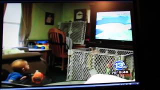 8 month old who loves to watch the news and Glenn Johnson the Meteorologist.