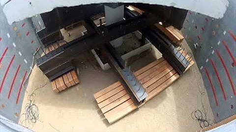 Large scale shake table test of columns supported on rocking shallow foundations