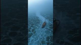 Onboard Rescue Boat View of Cargo Ship in Heavy Sea