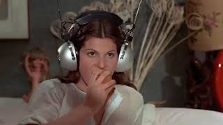 Simonetta Stefanelli wears huge radio headphones in 'In The Name of the Italian People' 1971