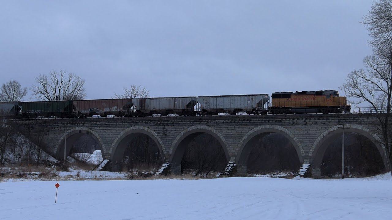 Union Pacific SoBo local on return trip in the snow & going across the stone arch bridge! 1/17/2021