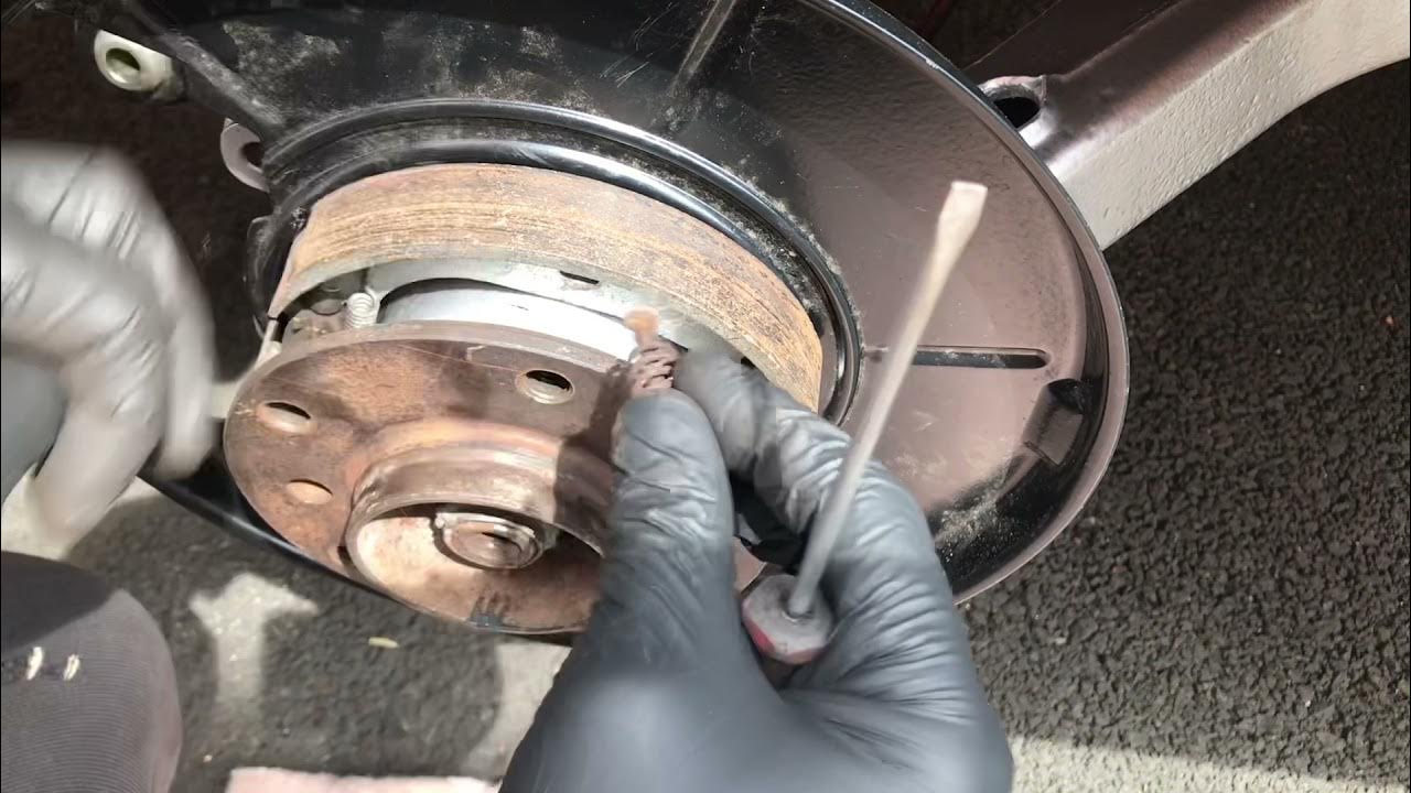 BMW handbrake assembly shoes replacement installation adjustment e36