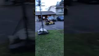 Guy rides go kart up ramp and crashes into car