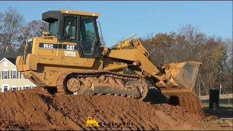 Caterpillar 963C Track Loader Smoothing Out a Hill