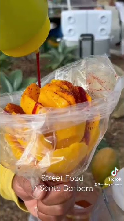 Street Food In Santa Barbara. Mango with Red Paprika and Hot Sauce. Sheeesh.