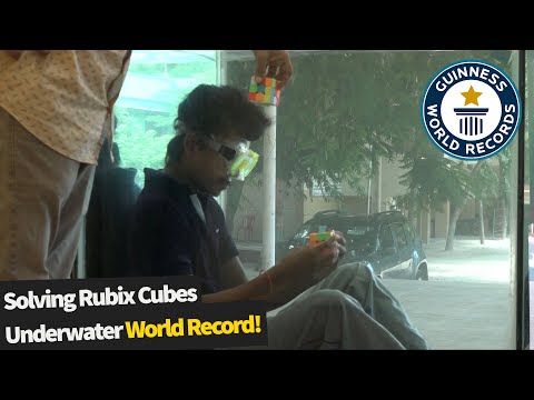 Six Rubik's Cubes Solved Underwater In One Breath | Guinness World Record