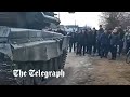 Unarmed Ukrainians stop Russian tank from entering village