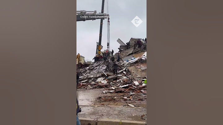Moment building collapses in Turkey as rescuers continue earthquake searches