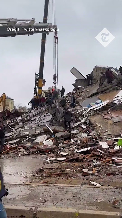 Moment building collapses in Turkey as rescuers continue earthquake searches