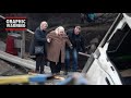 Ukrainians flee over bombed-out bridge under shelling