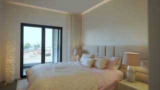 Exceptional penthouse with private rooftop oasis and sea views