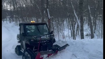 Polaris Ranger with tracks and Boss Vee Plow cleaning up snow!
